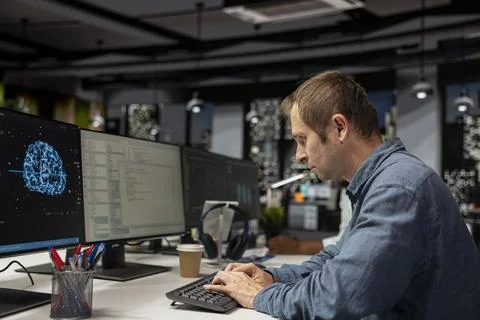 Computer scientist using machine learning in tech startup office 写真素材