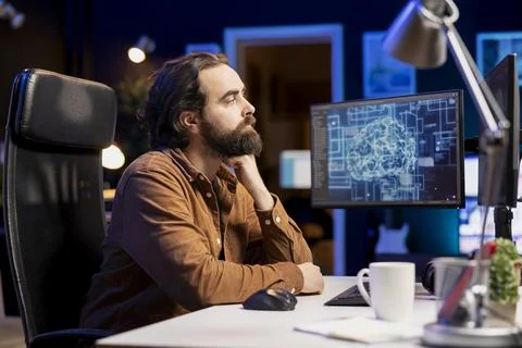 Computer scientist using PC to maintenance AI neural networks 写真素材