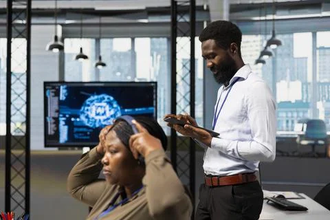 Computer scientist utilizing artificial intelligence to optimize performance Stock Photos