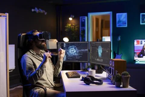 Computer scientist with VR glasses on working to achieve AI superintelligence Stock Photos