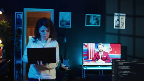 Computer scientist walking at home, developing software using laptop Stock Footage 283691311