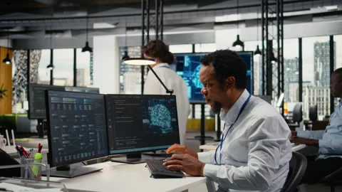 Computer scientist working in AI startup trains predictive models Stock Footage 322705496