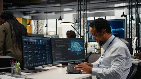 Computer scientist working in AI startup trains predictive models 写真素材