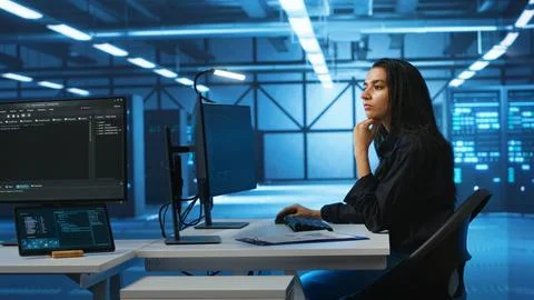 Computer scientist working in high tech server hub Stock Photos
