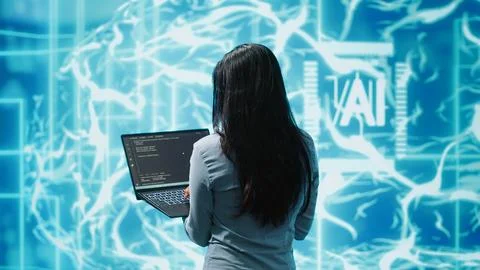 Computer scientist working on laptop, programming artificial intelligence Stock Photos