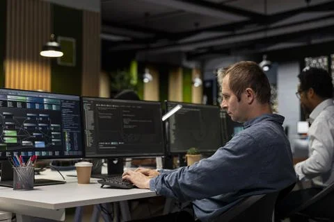 Computer scientist writing code, developing machine learning APIs Stock Photos