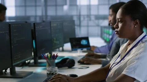 Computer scientists in data center implementing AI systems Stock Footage 319537178