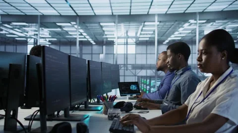 Computer scientists in data center implementing AI systems Stock Footage 319574288