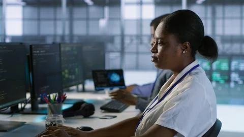 Computer scientists in data center implementing AI systems 스톡 사진