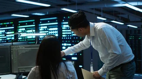 Computer scientists in data center managing and maintaining databases 스톡 사진