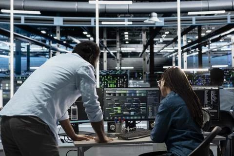 Computer scientists working in data center used for machine learning training Stock Photos
