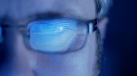 Computer screen and code reflected in man's glasses Stock-Footage 33897664