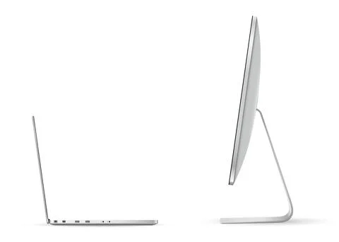 Computer screen and laptop opposite each other isolated on white background Illustrazione stock