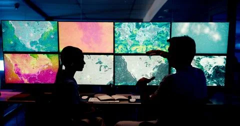 Computer, screen and maps with people in control room for storm tracking Stock Photos
