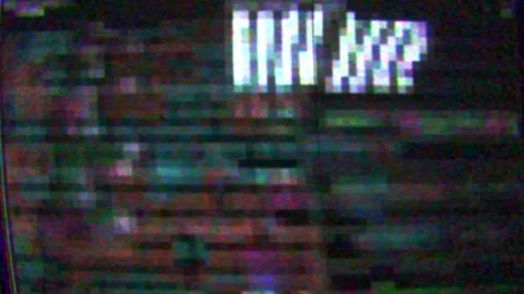 Computer screen background featuring software code with VHS TV damage Stock Footage 323825923