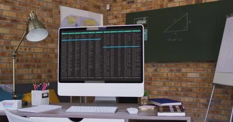 Computer screen with data processing standing on desk in office 写真素材