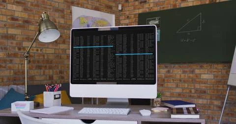 Computer screen with data processing standing on desk in office Foto stock