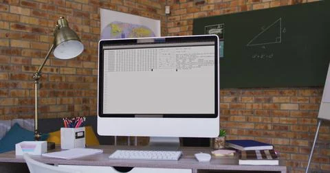 Computer screen with data processing standing on desk in office Foto stock