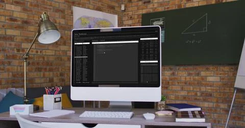 Computer screen with data processing standing on desk in office Stockfoto's