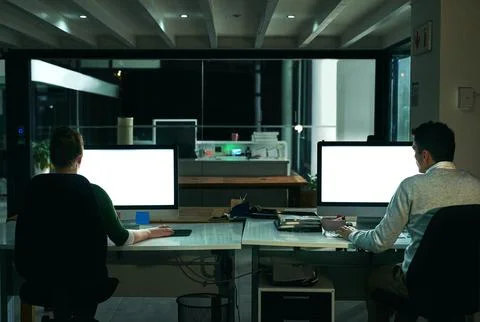 Computer screen, design and night with business people in office together for Stock Photos