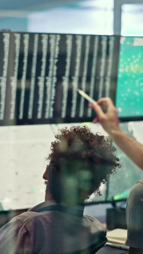 Computer screen, discussion and people in control room with research for Stock Footage 335285927