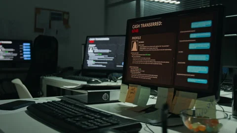Computer Screen Displaying Cyber Attack Data Transfer in Dark Office Stock Footage 346691293