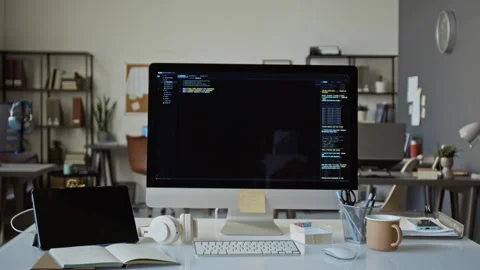 Computer Screen Displaying Programming Code in Modern Office 库存影片 348140755