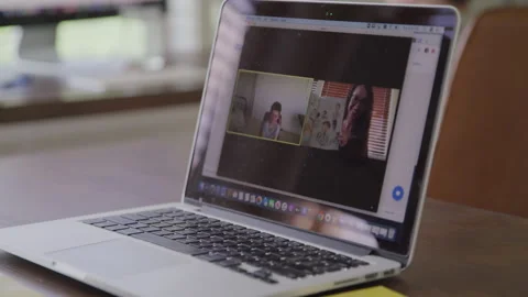 Computer Screen of Female Teacher Reading to Her Virtual Class Video stock 208771330