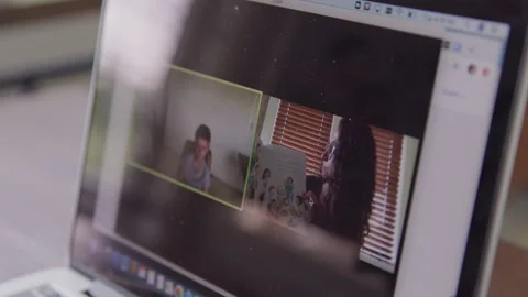 Computer Screen of Female Teacher Reading to Her Virtual Student Video stock 208771409