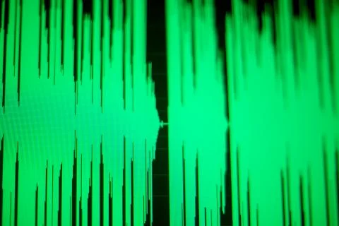 Computer screen with a green wave diagram on display Stock Photos