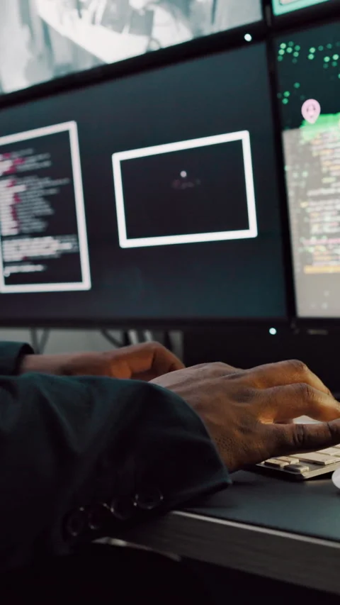 Computer screen, hands and typing with person in surveillance control room for Stock Footage 335285865
