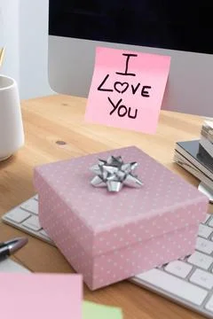 Computer Screen with I Love You Note and Gift Box on Keyboard Stock Photos