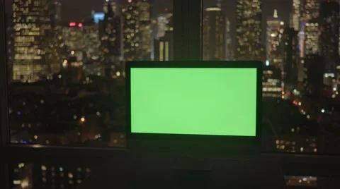 Computer screen isolated with green-screen background in modern city office Stock Footage