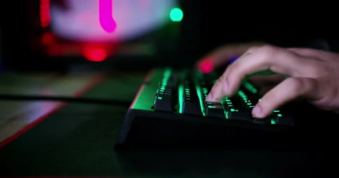 Computer screen, keyboard and man typing, gaming and play online challenge Video stock 254220739