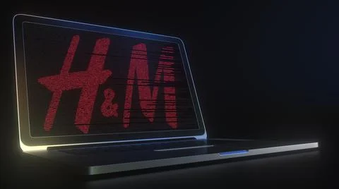 Computer screen with the logo of HM made with source code. Editorial conceptual Illustrazione stock