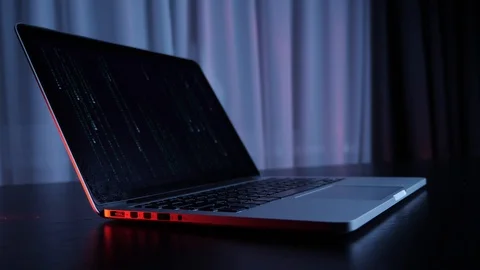 Computer screen with matrix code. Laptop with matrix on screen on the table, Stock Footage 125213217