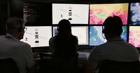 Computer screen, meteorology and back of people in control room for storm, .. Foto stock