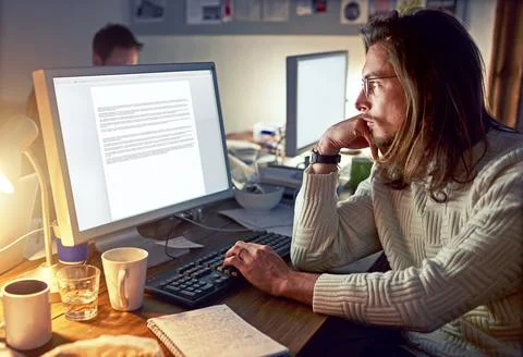 Computer screen, night and man think in office for proofreading, story review Stock Photos