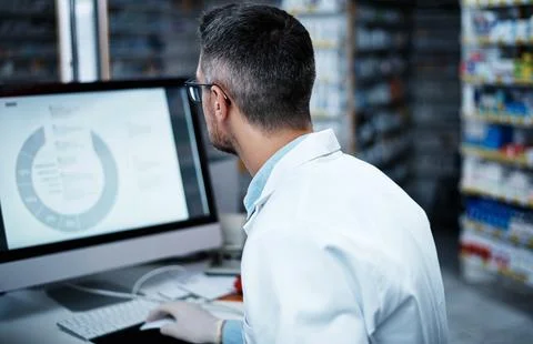 Computer screen, pharmacy and reading with man in store for drug developmen.. Stock Photos