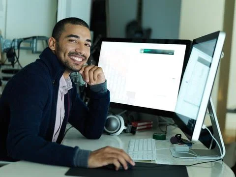 Computer screen, portrait and smile of programmer at desk in office for coding Stock Photos