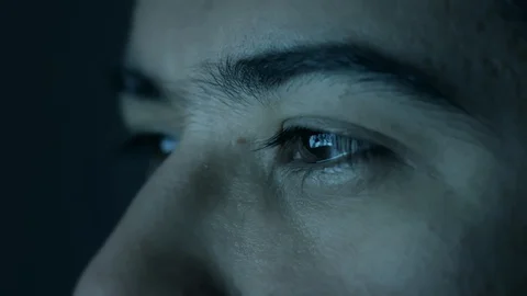 Computer screen reflected on man's eyes looking down. Stock Footage 101783205