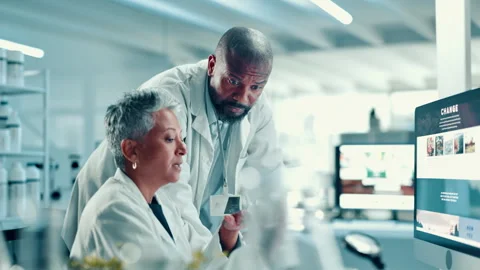 Computer screen, sample and science with people in laboratory together for 動画素材 310606450