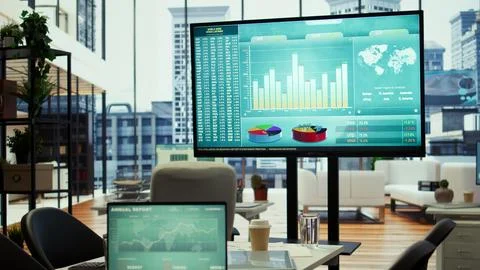 Computer screen showcases business data and statistics In professional boardroom Stock Photos