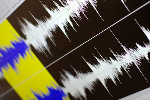 Computer screen showing audio editing software Photos