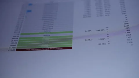 Computer screen showing torrent client seeding and downloading with progress Stock Footage 320675073