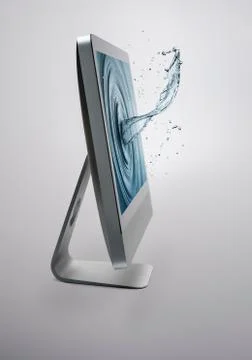 Computer screen with splash of water on screen Stock Photos