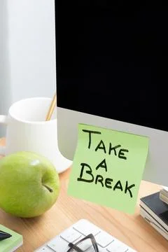 Computer Screen with Sticky Note Saying "Take a Break" as a Reminder to Rest Stock Photos