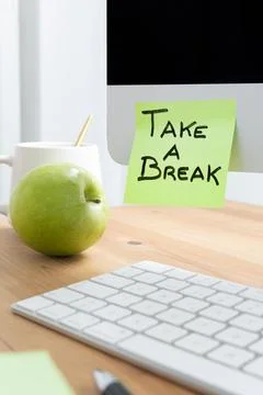 Computer Screen with Sticky Note Saying "Take a Break" as a Reminder to Rest Stock Photos