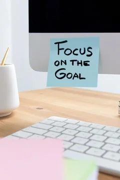 Computer Screen with Sticky Note Saying "Focus on the Goal" as a Motivation.. Stock Photos
