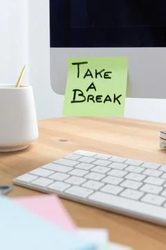 Computer Screen with Sticky Note Saying "Take a Break" as a Reminder to Rest Stock Photos